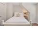 Cozy bedroom featuring a comfortable bed with crisp white bedding and a charming nightstand with a lamp at 1718 Ridgewood Ne Dr, Atlanta, GA 30307