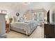 Comfortable bedroom featuring neutral tones, natural lighting, and a sitting area at 1718 Ridgewood Ne Dr, Atlanta, GA 30307