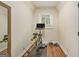 Compact exercise room featuring hardwood floors, a stationary bike, and ample natural light from the window at 1718 Ridgewood Ne Dr, Atlanta, GA 30307