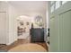 Welcoming foyer with hardwood floors, a decorative mirror, and dining room view at 1718 Ridgewood Ne Dr, Atlanta, GA 30307
