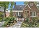Inviting brick home with a cozy front porch and meticulous landscaping at 1718 Ridgewood Ne Dr, Atlanta, GA 30307