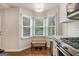 Eat-in kitchen area with bright bay windows providing natural light at 1718 Ridgewood Ne Dr, Atlanta, GA 30307
