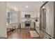 Charming kitchen featuring stainless steel appliances, modern lighting, and green lower cabinets at 1718 Ridgewood Ne Dr, Atlanta, GA 30307