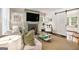 Bright living room with fireplace, sliding barn door, and comfortable seating at 1718 Ridgewood Ne Dr, Atlanta, GA 30307