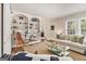 Comfortable living room with built-in bookshelves, hardwood floors, and neutral decor at 1718 Ridgewood Ne Dr, Atlanta, GA 30307