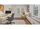 Bright home office features built-in shelving and a comfortable window seat at 1718 Ridgewood Ne Dr, Atlanta, GA 30307