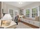 Bright home office features built-in shelving and a comfortable window seat at 1718 Ridgewood Ne Dr, Atlanta, GA 30307
