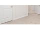 Neutral hallway with white doors, trim and neutral carpet at 284 Limestone Circle, Conyers, GA 30013