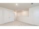 Upstairs hallway with neutral carpet, white trim and doors, and access to attic at 284 Limestone Circle, Conyers, GA 30013