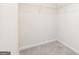Bright walk-in closet features wire shelving and neutral carpet at 284 Limestone Circle, Conyers, GA 30013