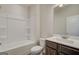 Bright bathroom with a tub/shower combo, toilet, and vanity featuring neutral finishes for a clean look at 402 Westmarch Cir # 285A, Loganville, GA 30052