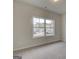 Cozy bedroom with large window, neutral carpet, and paint providing a blank canvas for personal customization at 402 Westmarch Cir # 285A, Loganville, GA 30052