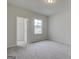 Bright bedroom with neutral carpet and walk in closet by window at 402 Westmarch Cir # 285A, Loganville, GA 30052