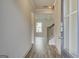 Inviting foyer with hardwood floors, staircase, and view into the living area with coffered ceilings at 402 Westmarch Cir # 285A, Loganville, GA 30052