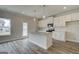Modern kitchen featuring white cabinets, granite countertops, stainless steel appliances, and island at 402 Westmarch Cir # 285A, Loganville, GA 30052