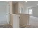 Open landing with neutral carpet and paint that connects the upper level, providing versatile living space at 402 Westmarch Cir # 285A, Loganville, GA 30052