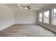 Bright living room with coffered ceiling, large windows, and hardwood floors at 402 Westmarch Cir # 285A, Loganville, GA 30052