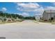 Street view showcasing the community entrance and newly built homes at 402 Westmarch Cir # 285A, Loganville, GA 30052