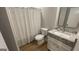 Cozy bathroom featuring a granite vanity top, white sink, and stylish shower curtain at 4710 Cedar Brook Se Dr, Conyers, GA 30094