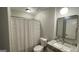 Bathroom featuring vanity, shower with curtain, and black-framed mirror at 4710 Cedar Brook Se Dr, Conyers, GA 30094