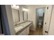 Modern bathroom vanity with dual mirrors, modern vanity lighting, and gray granite countertop at 4710 Cedar Brook Se Dr, Conyers, GA 30094