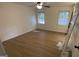 Bright bedroom with ceiling fan, wood floors, and plenty of natural light at 4710 Cedar Brook Se Dr, Conyers, GA 30094