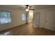 Bedroom with wood floors and two windows and an en suite bathroom at 4710 Cedar Brook Se Dr, Conyers, GA 30094
