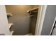 Interior of an empty closet with wooden shelving and a single hanger at 4710 Cedar Brook Se Dr, Conyers, GA 30094