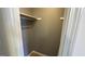 A view of an empty closet featuring a clothes rod and wooden shelving at 4710 Cedar Brook Se Dr, Conyers, GA 30094