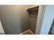 A bare closet with a clothes rod and shelf, ready for organizing your wardrobe at 4710 Cedar Brook Se Dr, Conyers, GA 30094