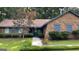 Home exterior showcasing a brick facade, tidy landscaping, and inviting walkway leading to the front entrance at 4710 Cedar Brook Se Dr, Conyers, GA 30094