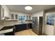 Kitchen with white cabinets, granite countertops, stainless steel appliances, and a bright window above the sink at 4710 Cedar Brook Se Dr, Conyers, GA 30094