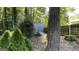 Backyard view of a shed with mature trees at 4710 Cedar Brook Se Dr, Conyers, GA 30094