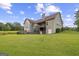 Expansive backyard featuring a deck, slide, and trampoline, perfect for Gathering fun at 9360 Ward Rd, Winston, GA 30187