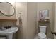 Powder room with a modern sink and a decorative mirror offers a convenient space for guests at 9360 Ward Rd, Winston, GA 30187