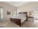 Spacious bedroom features a tray ceiling and a large bed that provides a serene retreat at 9360 Ward Rd, Winston, GA 30187