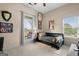 Neutral bedroom featuring natural light, carpet flooring, and wall decor at 9360 Ward Rd, Winston, GA 30187