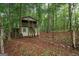 Cozy cabin in the woods featuring a quaint balcony and rustic charm at 9360 Ward Rd, Winston, GA 30187