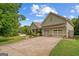 Landscaped home with a 2-car garage, long driveway and large lawn at 9360 Ward Rd, Winston, GA 30187