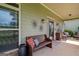Inviting front porch with comfortable seating, decorative wall art, and a 'welcome' sign at 9360 Ward Rd, Winston, GA 30187
