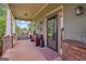 Welcoming front porch featuring a cozy bench, decorative elements, and a neatly arranged welcome mat at 9360 Ward Rd, Winston, GA 30187