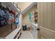 Functional laundry room with a washer and dryer and storage shelves at 9360 Ward Rd, Winston, GA 30187