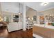 Open-concept living room with hardwood floors, a fireplace, and comfortable, modern furnishings at 9360 Ward Rd, Winston, GA 30187