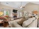 Cozy living room features a stone fireplace and plush furniture for relaxing and entertaining in style at 9360 Ward Rd, Winston, GA 30187
