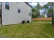 Spacious backyard with a grassy lawn and a wooden fence for privacy at 101 Fairfield Nw Pl, Atlanta, GA 30314