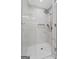 Bathroom featuring glass enclosed walk-in shower with a marble wall surround and hexagon tile floor at 101 Fairfield Nw Pl, Atlanta, GA 30314