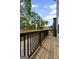 Wood deck overlooking yard, with wooden railings and view of the neighborhood at 101 Fairfield Nw Pl, Atlanta, GA 30314