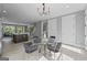 Open concept dining area featuring a glass table, modern chairs, and view of the kitchen at 101 Fairfield Nw Pl, Atlanta, GA 30314