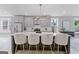 Spacious kitchen with gray cabinets, stainless steel appliances, a large island with seating and designer lighting at 101 Fairfield Nw Pl, Atlanta, GA 30314