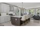 Bright kitchen featuring gray cabinets, white countertops, stainless steel appliances, and an island with seating at 101 Fairfield Nw Pl, Atlanta, GA 30314